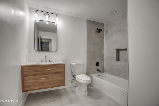 full bathroom with vanity, toilet, and tiled shower / bath