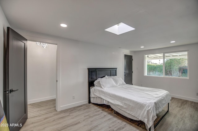 bedroom with light wood-type flooring and billiards