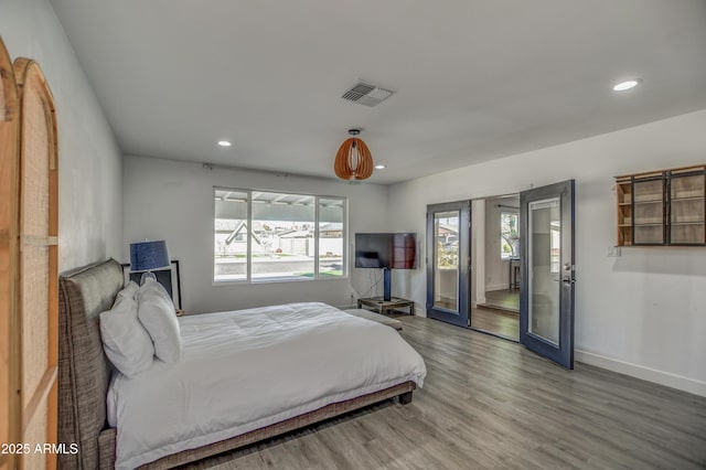 bedroom with wood-type flooring