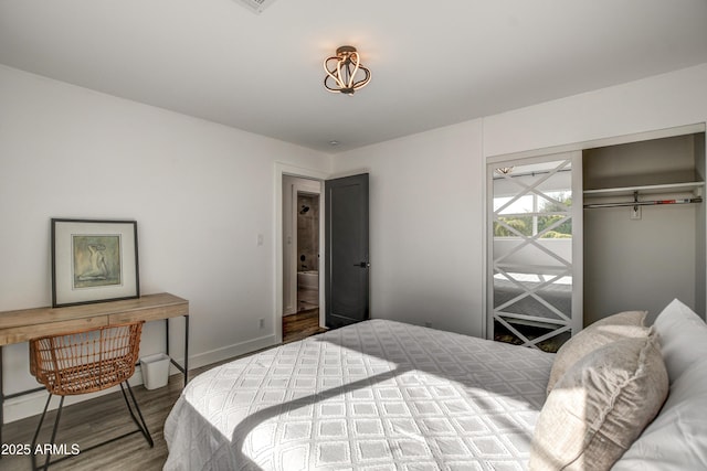 bedroom featuring a closet and hardwood / wood-style flooring