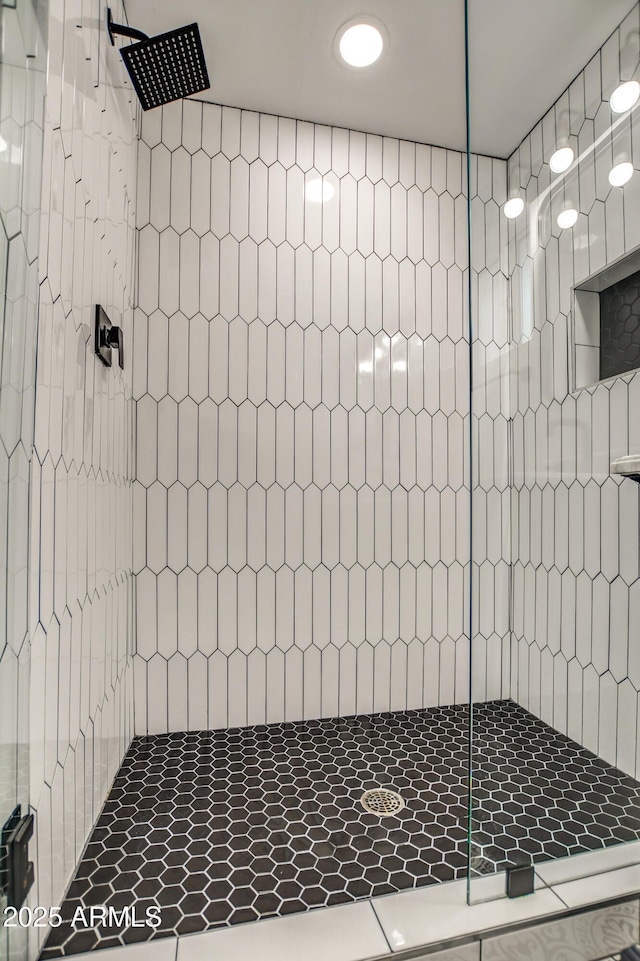 bathroom with tiled shower