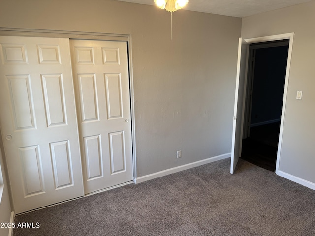 unfurnished bedroom with carpet flooring and a closet