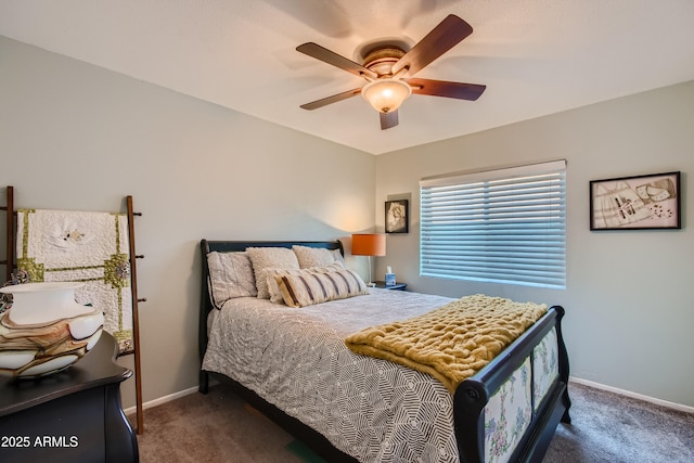 carpeted bedroom with ceiling fan and baseboards