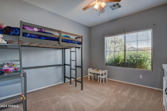 bedroom featuring light carpet and ceiling fan