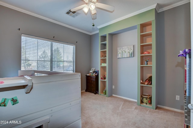 interior space featuring ceiling fan and crown molding