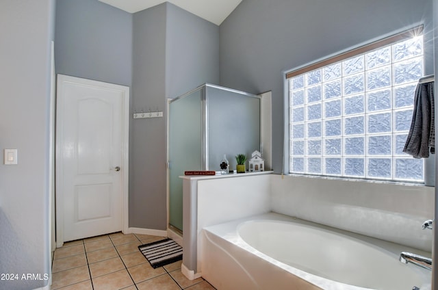 bathroom featuring plus walk in shower and tile patterned flooring