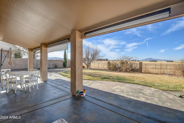 view of patio with a mountain view