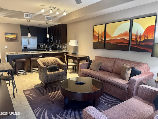 living area featuring visible vents