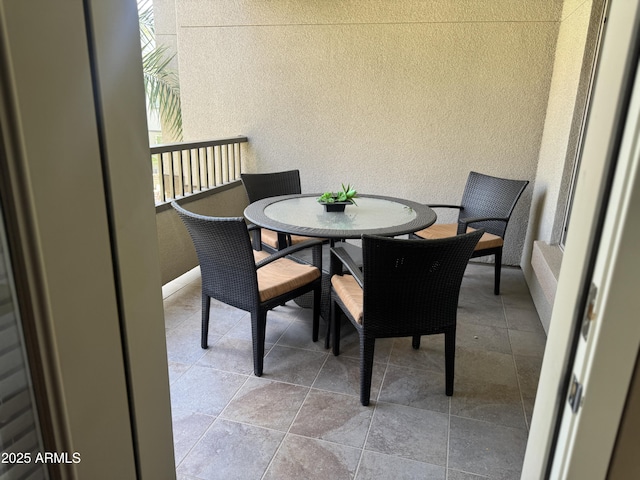 balcony with outdoor dining area