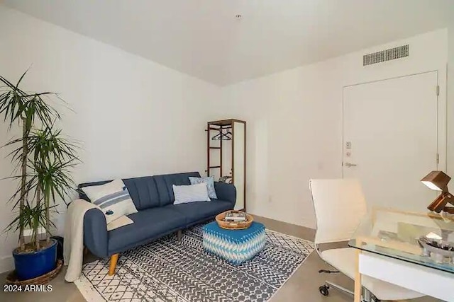 living room with concrete flooring