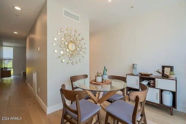 dining space featuring light hardwood / wood-style floors