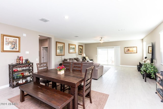 dining area featuring ceiling fan and light hardwood / wood-style flooring