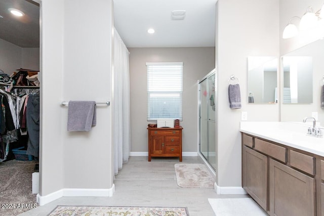 bathroom featuring vanity and walk in shower