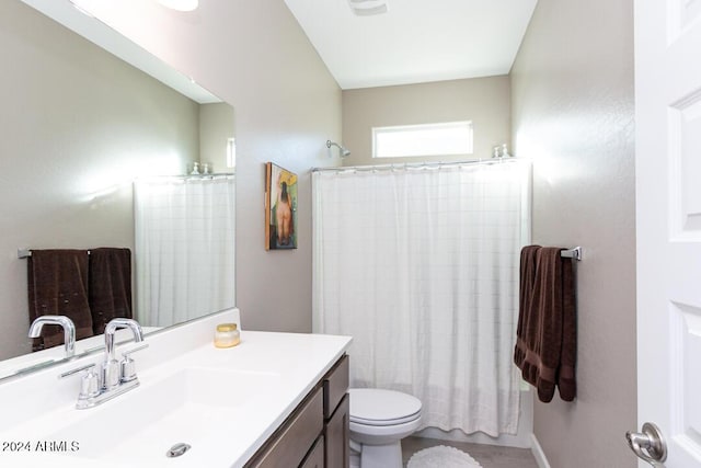 full bathroom with vanity, toilet, and shower / bath combo with shower curtain