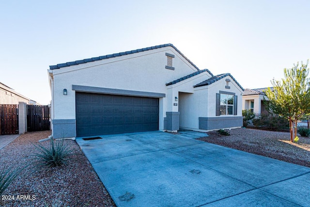 ranch-style home with a garage