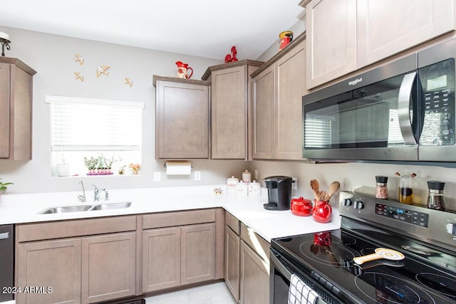 kitchen with sink and appliances with stainless steel finishes