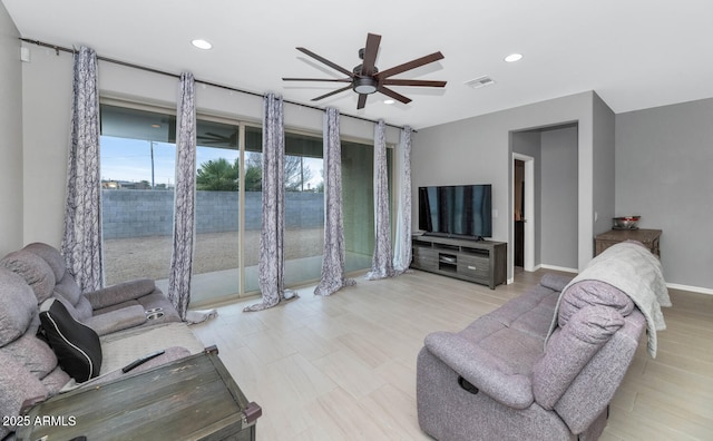 living room featuring ceiling fan