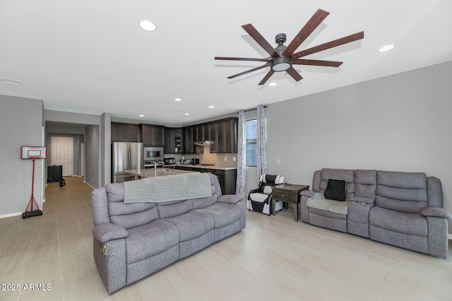 living room featuring ceiling fan