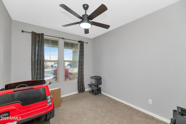 sitting room with light carpet and ceiling fan