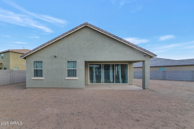 rear view of house with a patio