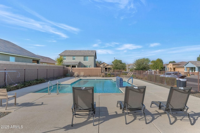 view of swimming pool with a patio