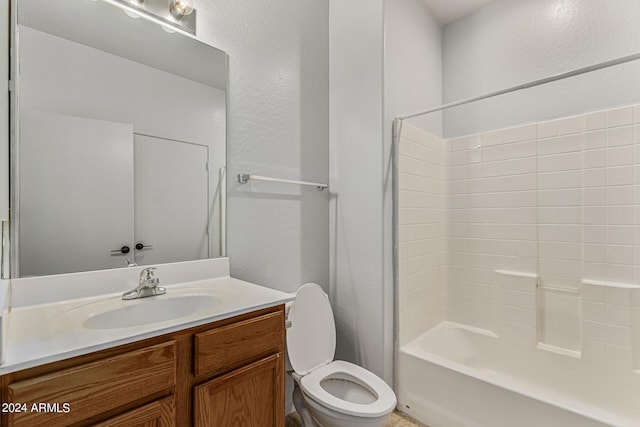 full bathroom with bathtub / shower combination, vanity, and toilet