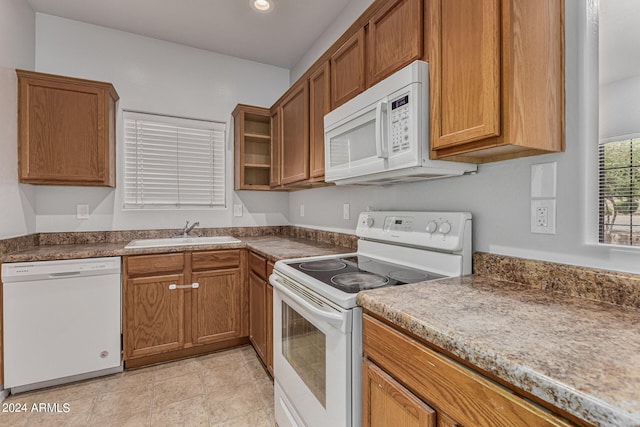 kitchen featuring sink and white appliances