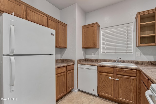 kitchen featuring sink and white appliances