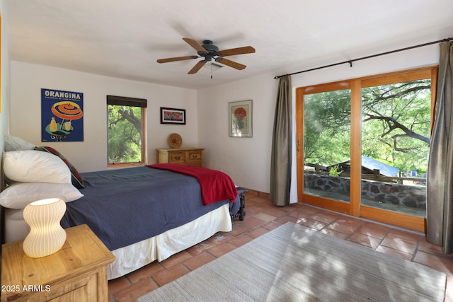 bedroom featuring access to outside and ceiling fan