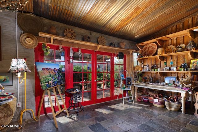 misc room featuring french doors, wooden ceiling, and stone tile floors
