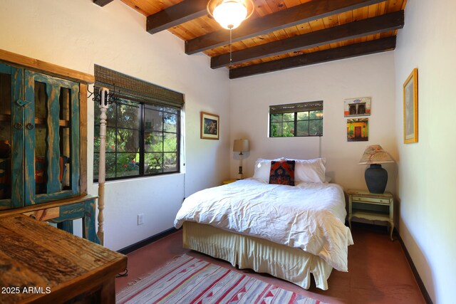 bedroom featuring wooden ceiling, beam ceiling, and baseboards