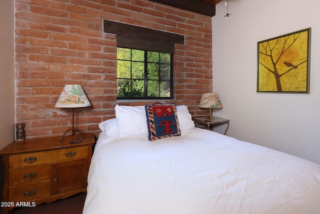 bedroom with brick wall