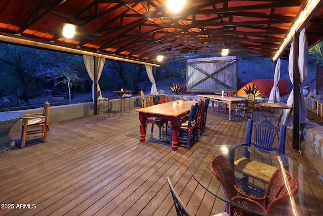 deck with outdoor dining area