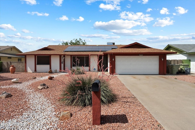 5808 W Acoma Dr, Glendale, AZ 85306 - ranch-style house with an attached garage, roof mounted solar panels, driveway, and a shingled roof