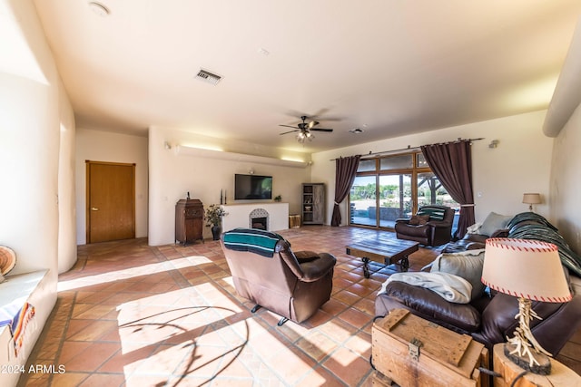 tiled living room featuring ceiling fan