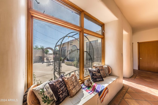 doorway featuring light tile patterned flooring