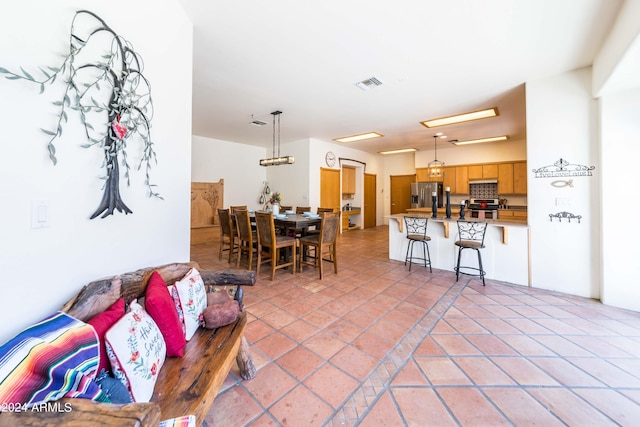 living room with light tile patterned floors