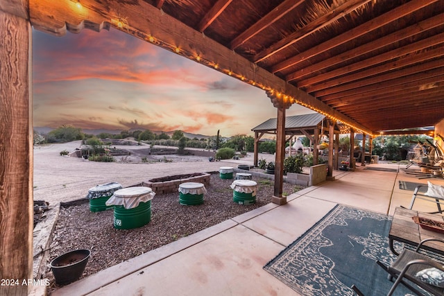 view of patio terrace at dusk