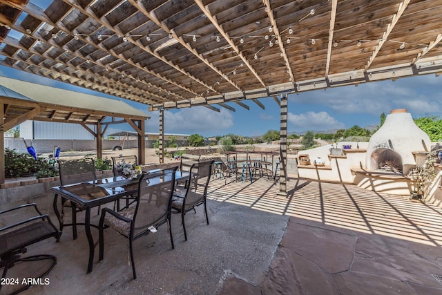 view of patio / terrace with an outdoor fireplace