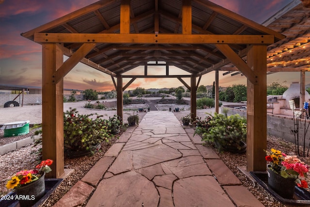 view of property's community with a gazebo and a patio