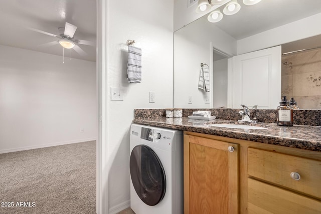 bathroom with vanity, washer / dryer, and ceiling fan