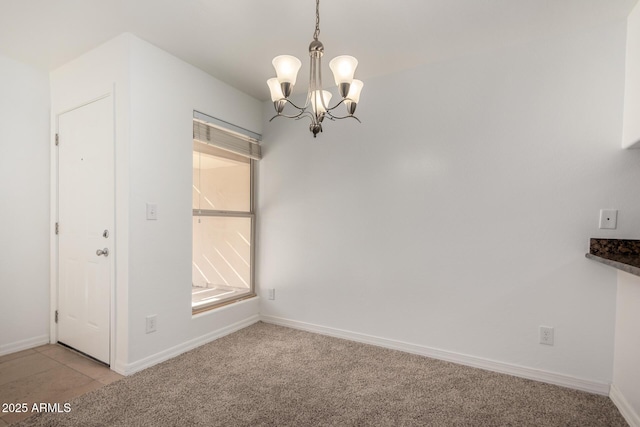 unfurnished dining area with light colored carpet and an inviting chandelier