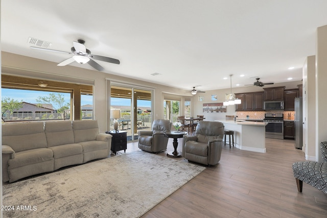 living room featuring light hardwood / wood-style flooring and plenty of natural light