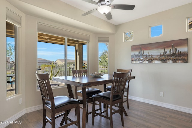 dining area featuring dark hardwood / wood-style floors and ceiling fan