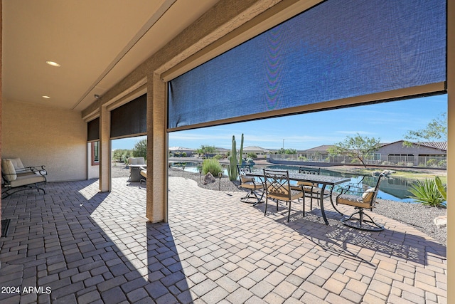 view of patio / terrace with a water view