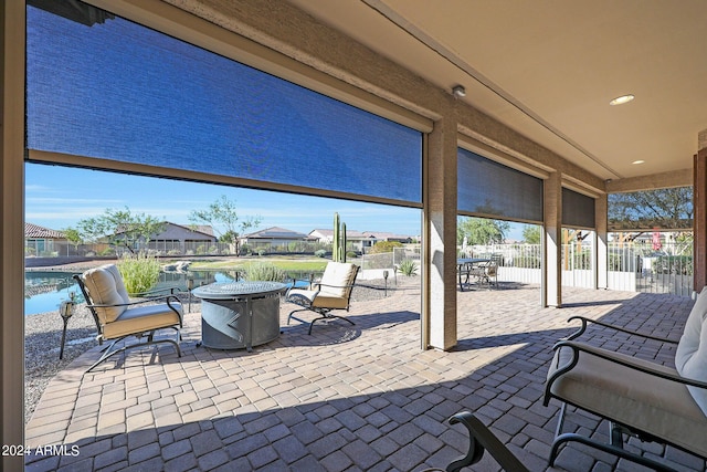 view of patio with a residential view, a swimming pool, and a fenced backyard
