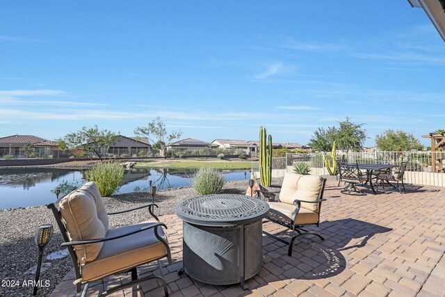 view of patio featuring a water view