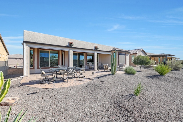 back of property featuring a patio area