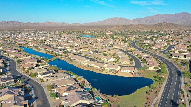 drone / aerial view featuring a residential view and a water and mountain view