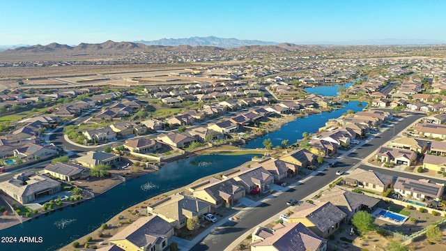 bird's eye view with a water and mountain view